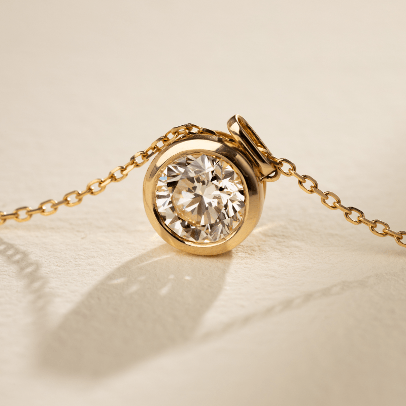 Front view of bezel-set lab-grown diamond gold vermeil pendant, 0.5ct round brilliant