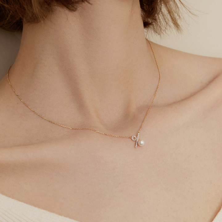 Akoya saltwater pearl and diamond necklace in 10K/18K yellow gold from Percent Collection, showcasing a elegant jewelry design.