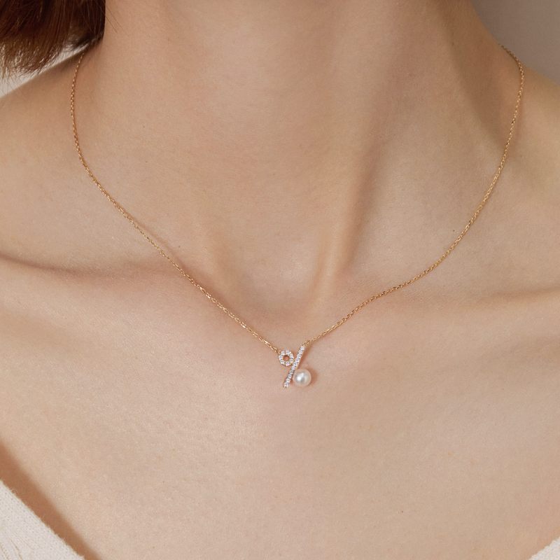Akoya saltwater pearl and diamond necklace in 10K/18K yellow gold from Percent Collection, featuring a delicate pendant design.