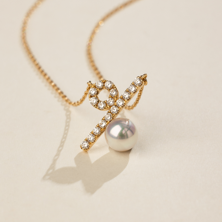 Akoya saltwater pearl and diamond pendant necklace in 10K/18K yellow gold from Percent Collection, showcasing elegant jewelry design.