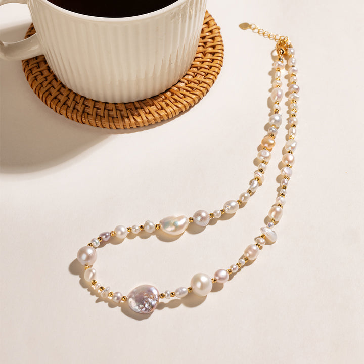 Baroque mixed freshwater pearl necklace in gold-plated 925 sterling silver, lifestyle flat lay with coffee cup