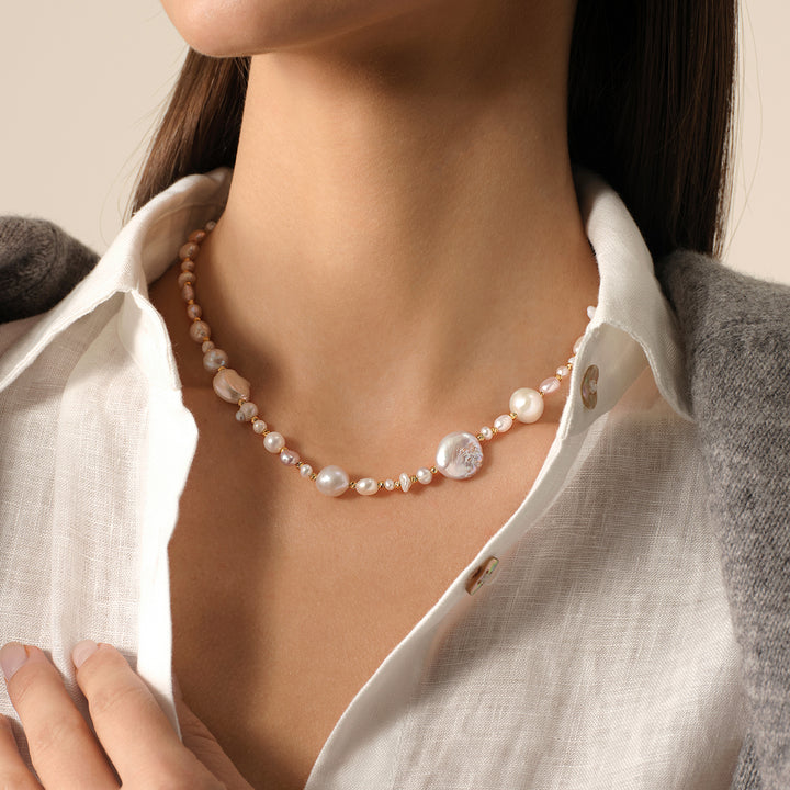 Model wearing baroque mixed freshwater pearl strand necklace in 925 sterling silver, side neck view