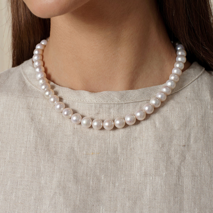 Front on-body view of freshwater pearl strand necklace in 925 sterling silver at neckline