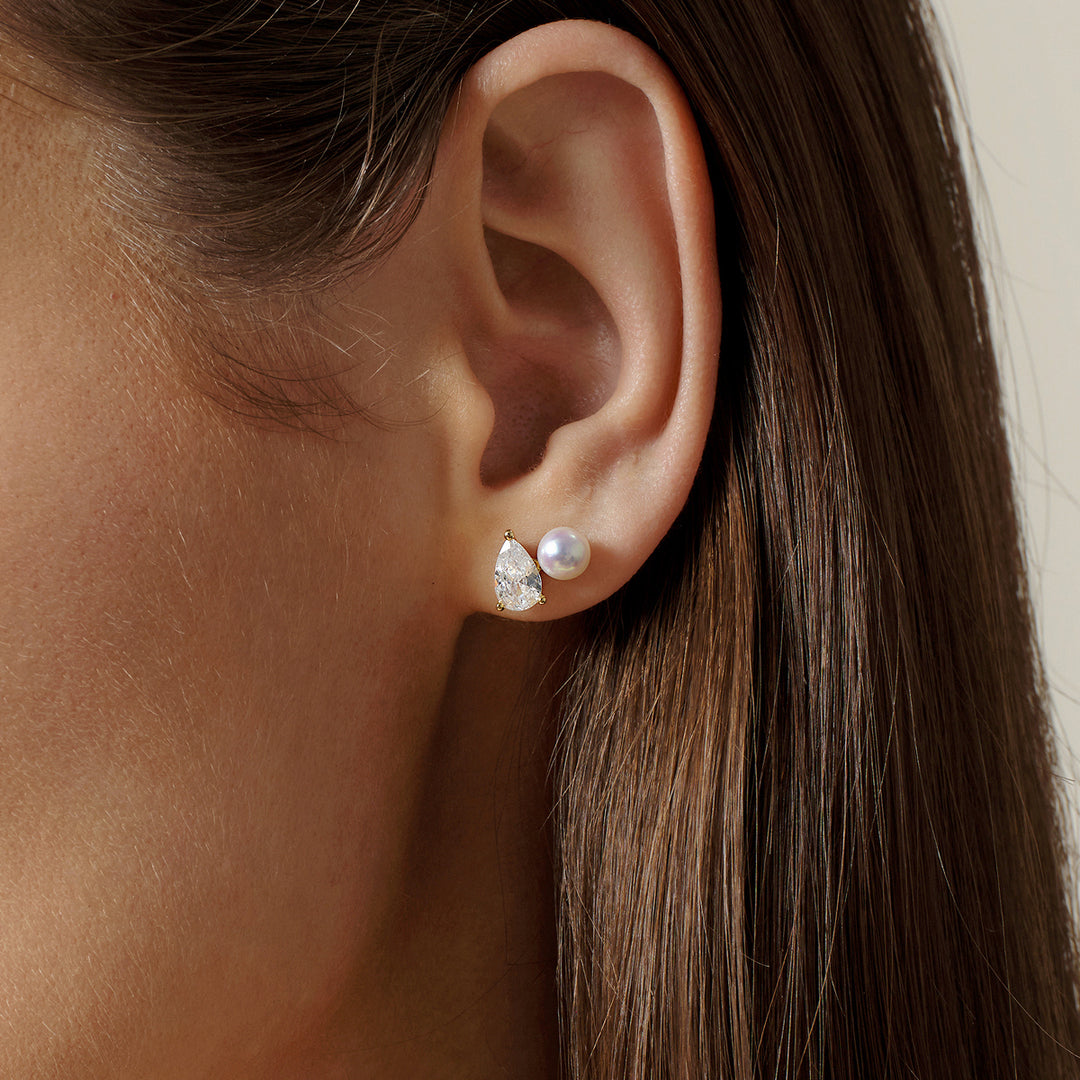 Model wearing gold plating freshwater pearl pear-cut CZ stud earring, side ear close-up