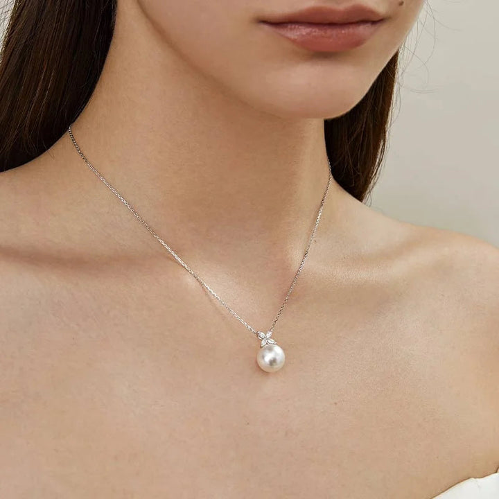 Model wearing freshwater pearl sterling silver diamond flower pendant necklace, front view