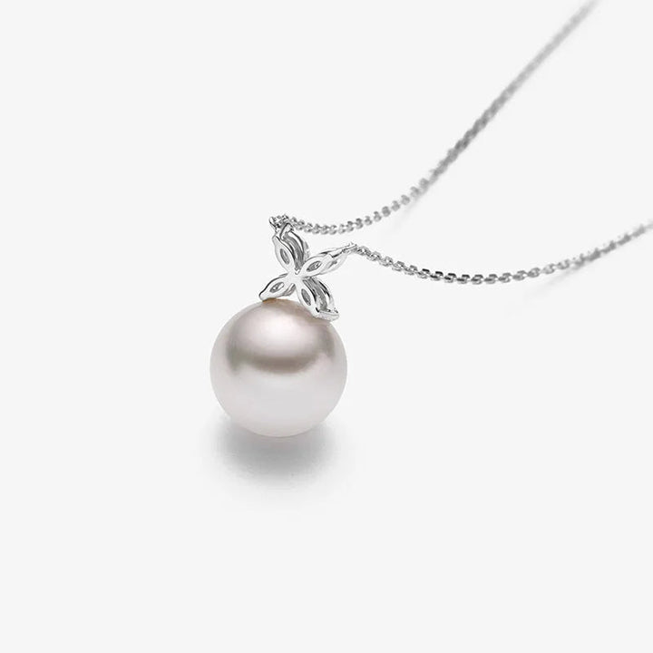 Side light detail of AAAAA freshwater pearl in rhodium-plated sterling silver diamond flower setting