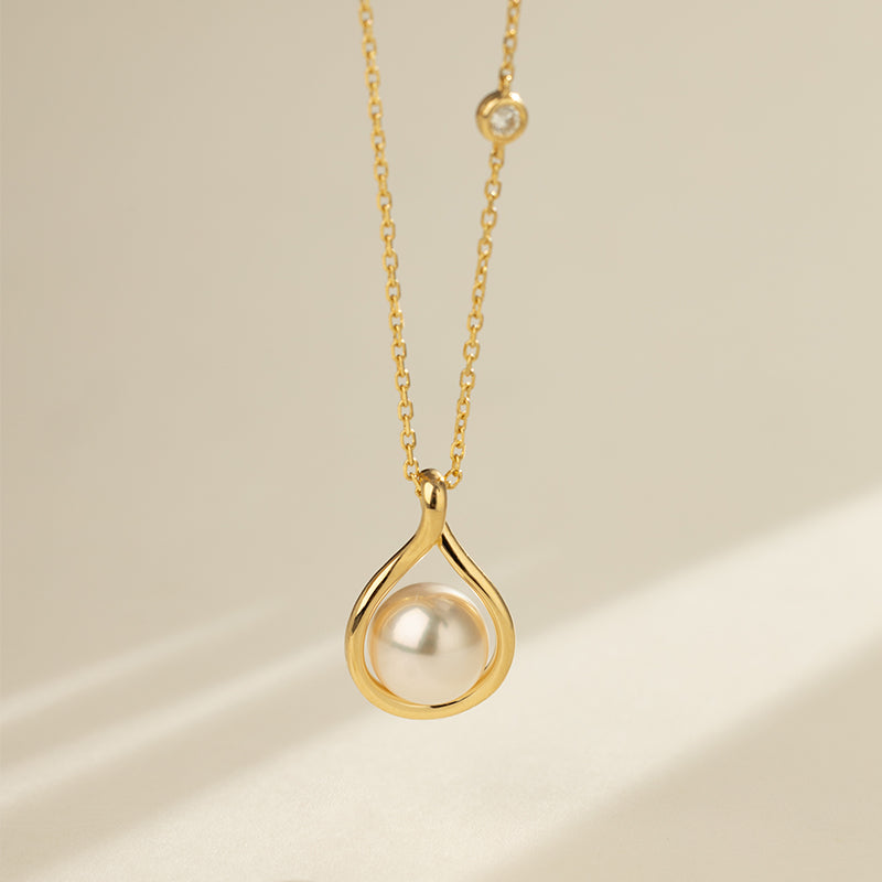 Close-up of AAAAA freshwater pearl set in gold vermeil teardrop pendant on sterling silver chain