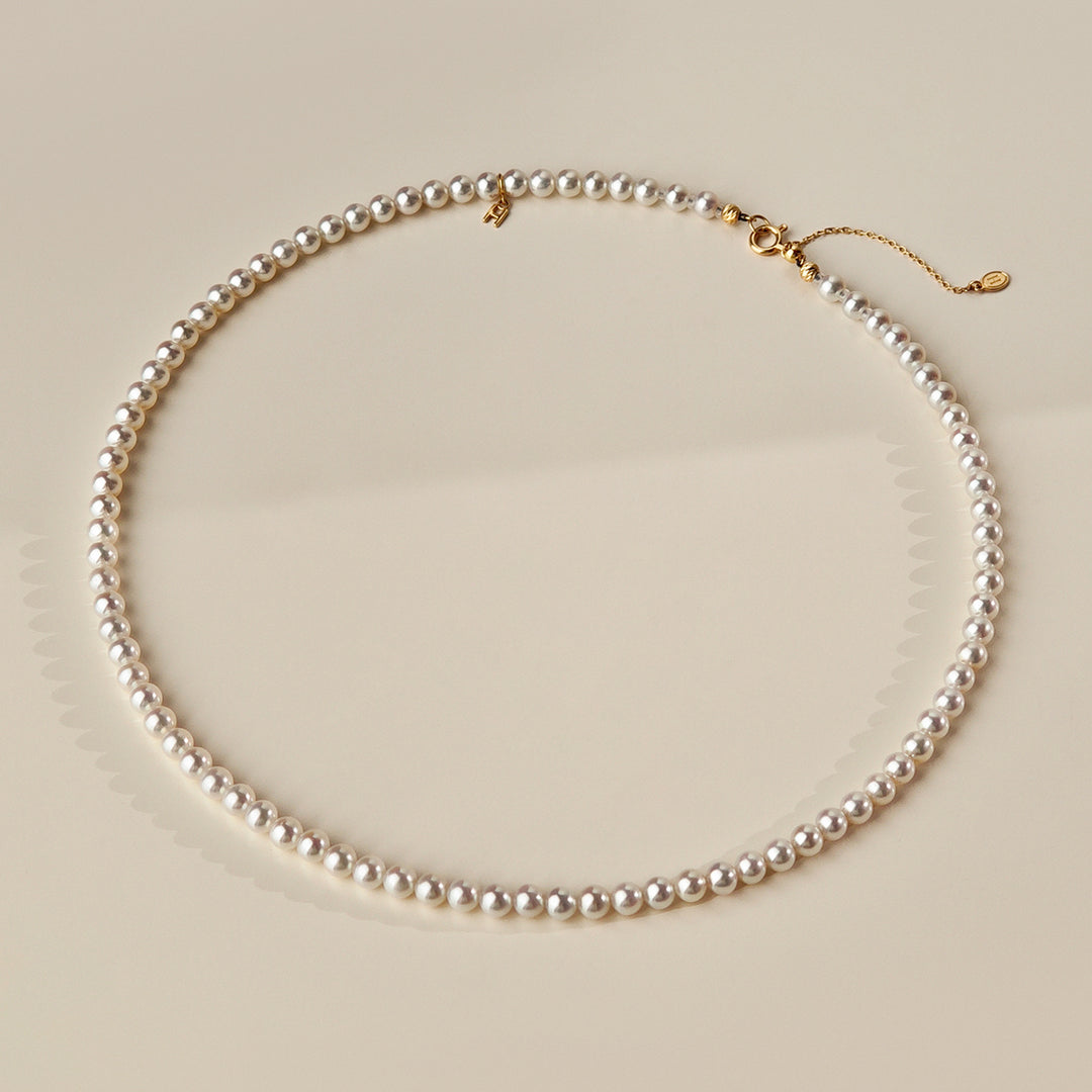 Aurora freshwater pearl gold vermeil strand necklace laid flat showing spring ring clasp and adjustable extender chain, 925 sterling silver