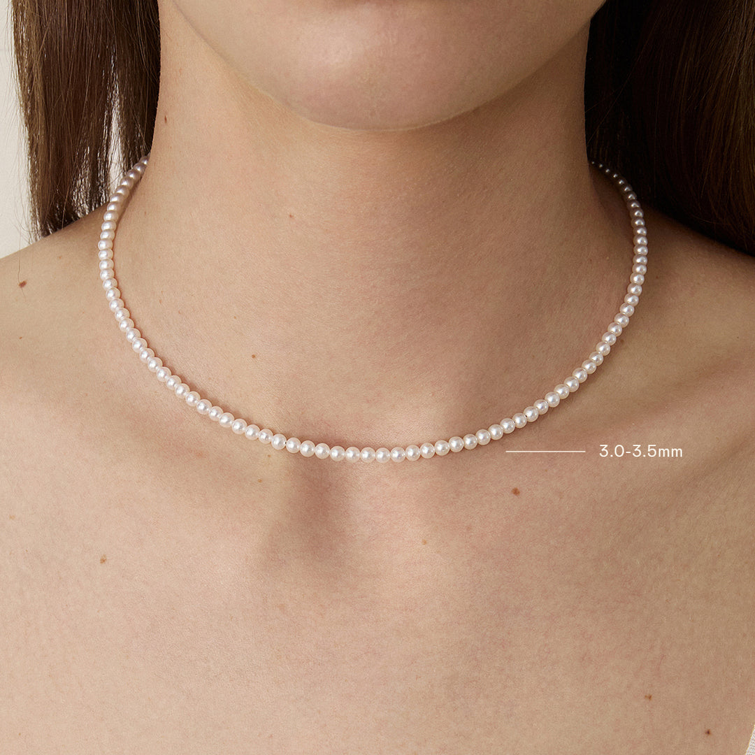 Model wearing Aurora freshwater pearl strand necklace in 925 sterling silver gold vermeil, pearl size 3.0-3.5mm shown on neck