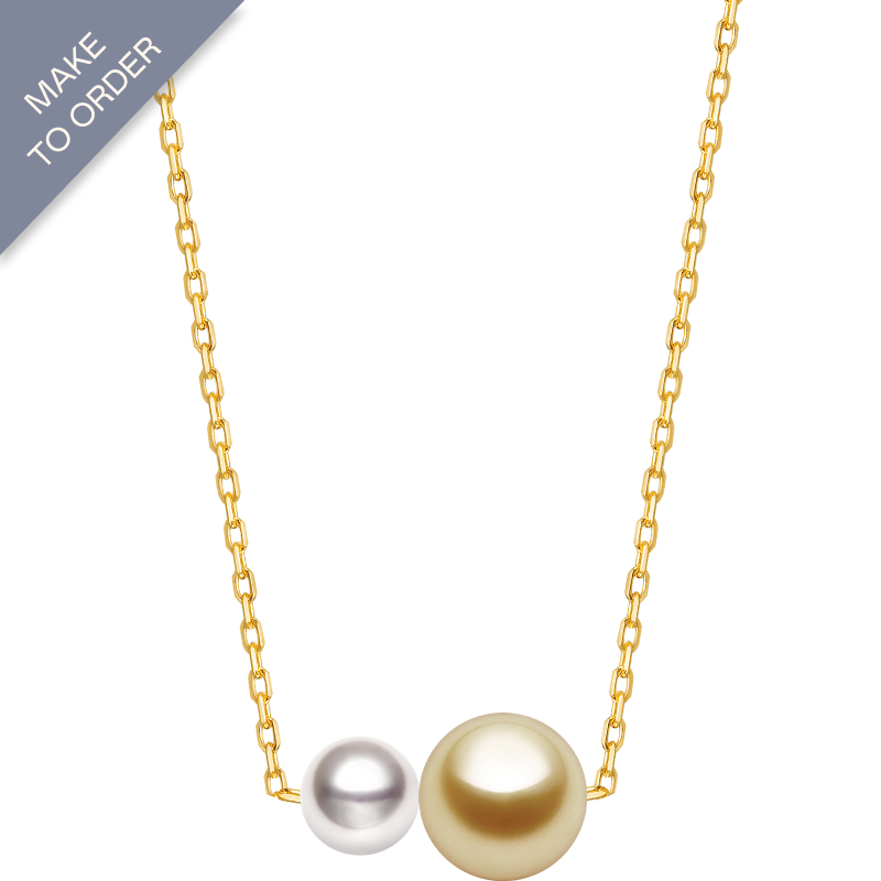 Twin saltwater pearl necklace with minimalist 18K gold design from Basic Collection, featuring two elegant pearls on a delicate chain.