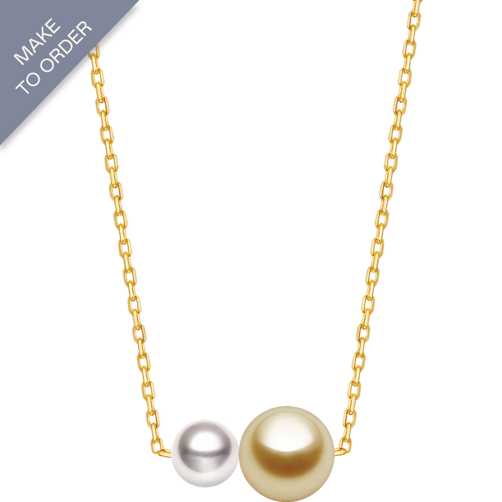 Twin saltwater pearl necklace with minimalist 18K gold design from Basic Collection, featuring two elegant pearls on a delicate chain.