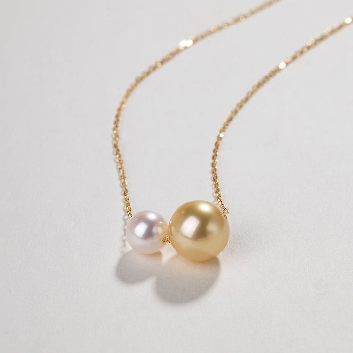 Twin saltwater pearl 18K gold necklace from Basic Collection featuring minimalist design and elegant style.