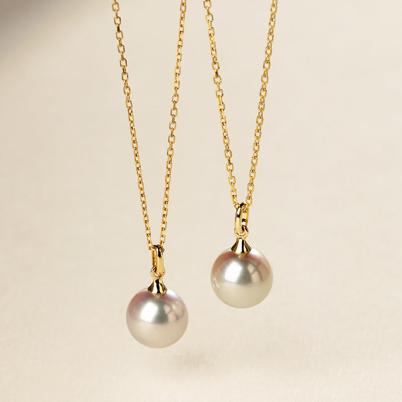 Saltwater pearl 18K gold classic buckle pendant necklace from Basic Collection, featuring a lustrous pearl and elegant gold setting.