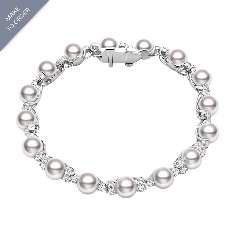 Elegant Akoya pearl and diamond bracelet in 18K white gold from Bridal Collection, showcasing lustrous pearls and sparkling diamonds.