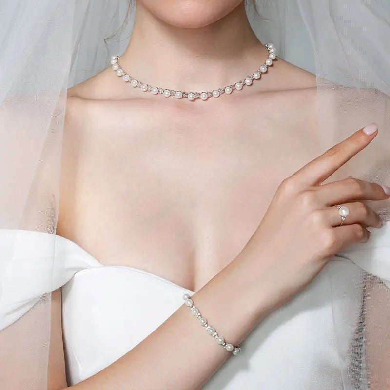 Elegant Akoya pearl and diamond bracelet in 18K white gold from Bridal Collection, showcasing lustrous pearls and sparkling diamonds.
