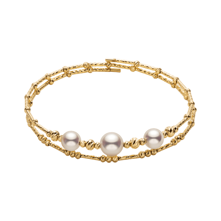 Gold vermeil sterling silver double-layer stretch bracelet with freshwater pearls, flat lay