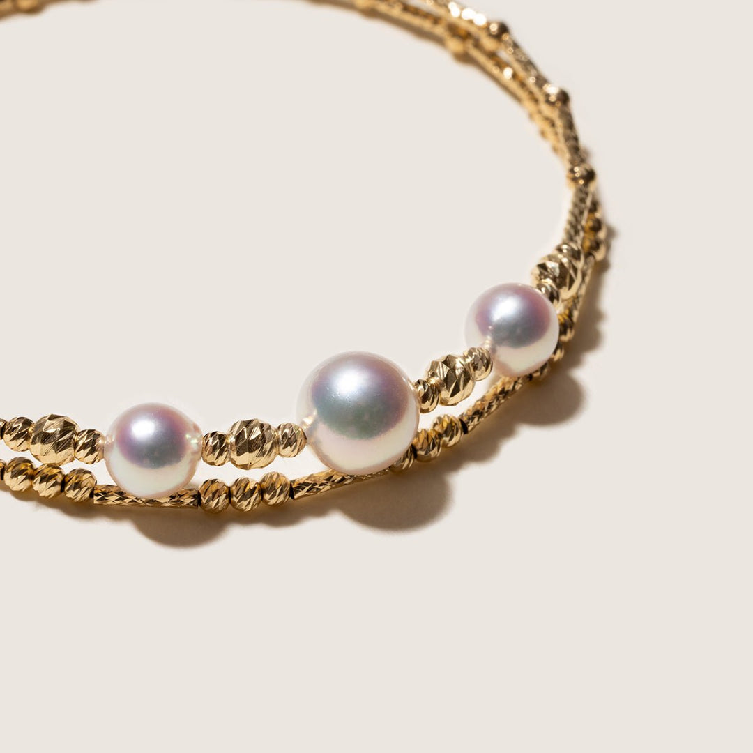 Close-up of a gold vermeil double-layer stretch bracelet with freshwater pearls