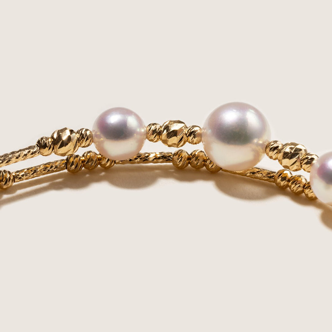 Close-up of AAAAA freshwater pearls and gold vermeil beads on a double-layer bracelet
