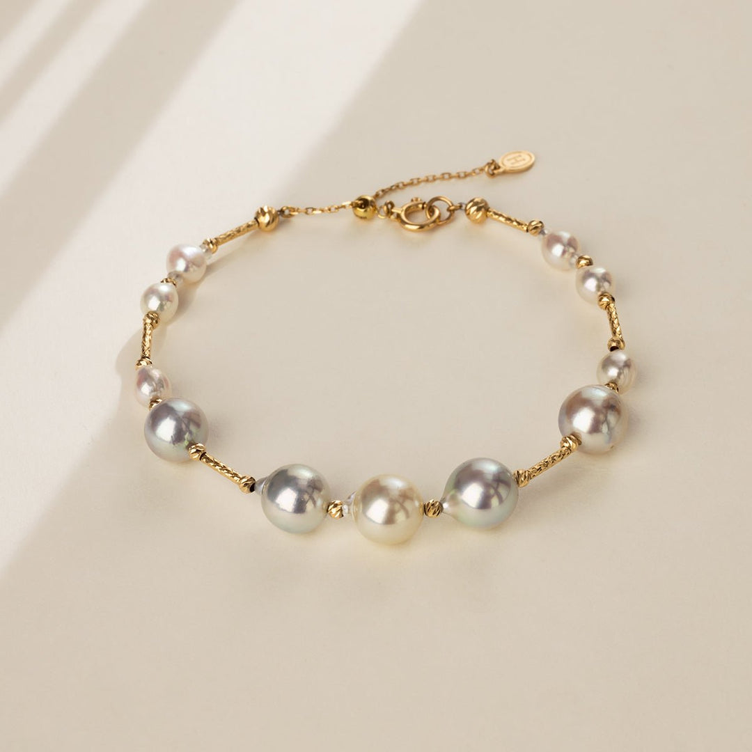 Gold vermeil multi-color baroque freshwater pearl bracelet on a neutral surface