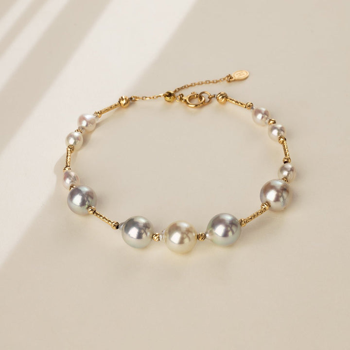 Gold vermeil multi-color baroque freshwater pearl bracelet on a neutral surface
