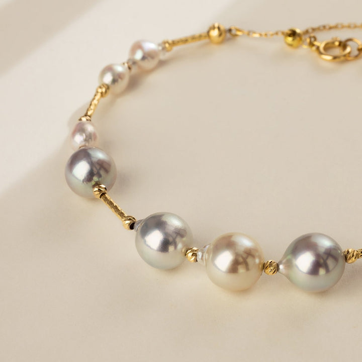 Close-up of multi-color baroque freshwater pearls on gold vermeil station bracelet