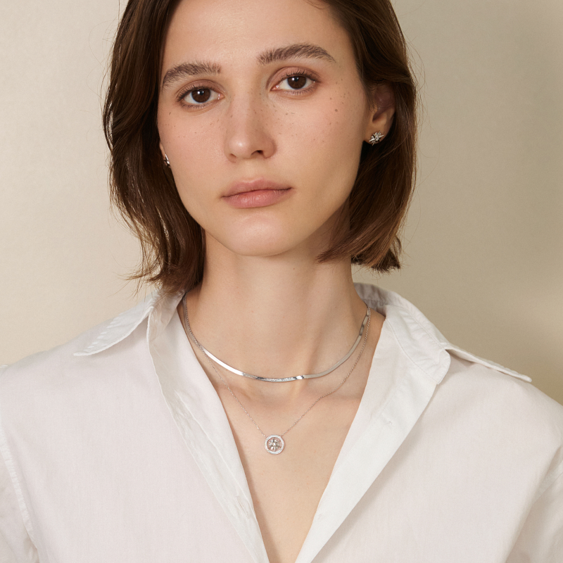 18K solid gold herringbone necklace from Fine Line Collection, showcasing a sleek, woven gold chain design.