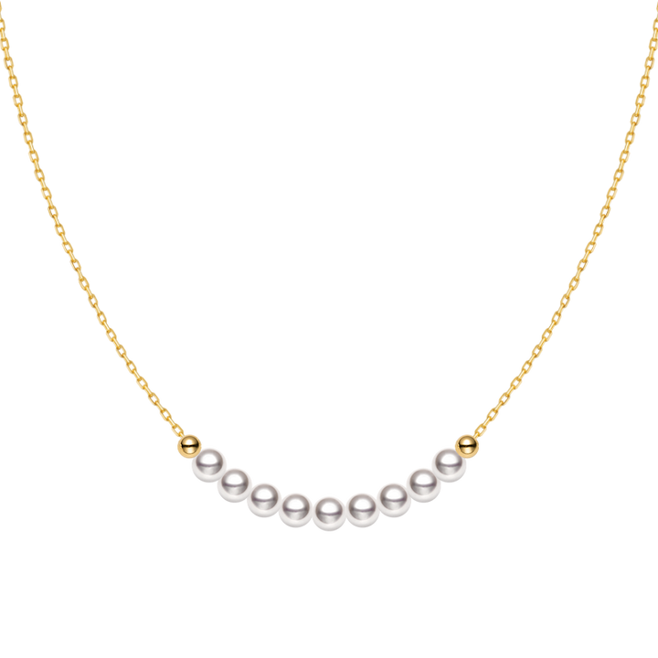 Akoya 18k yellow gold baby's breath smile necklace from Fine Line Collection showing a delicate gold chain with a small floral pendant.