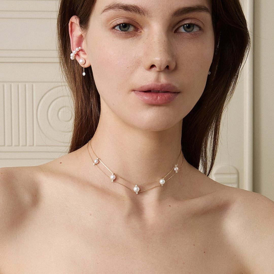Model wearing freshwater pearl lab-grown diamond gold vermeil necklace styled with matching earrings