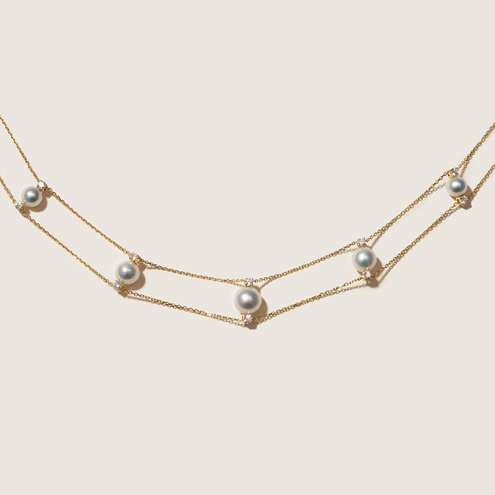 Flat lay of AAAAA freshwater pearl and lab-grown diamond gold vermeil double strand necklace