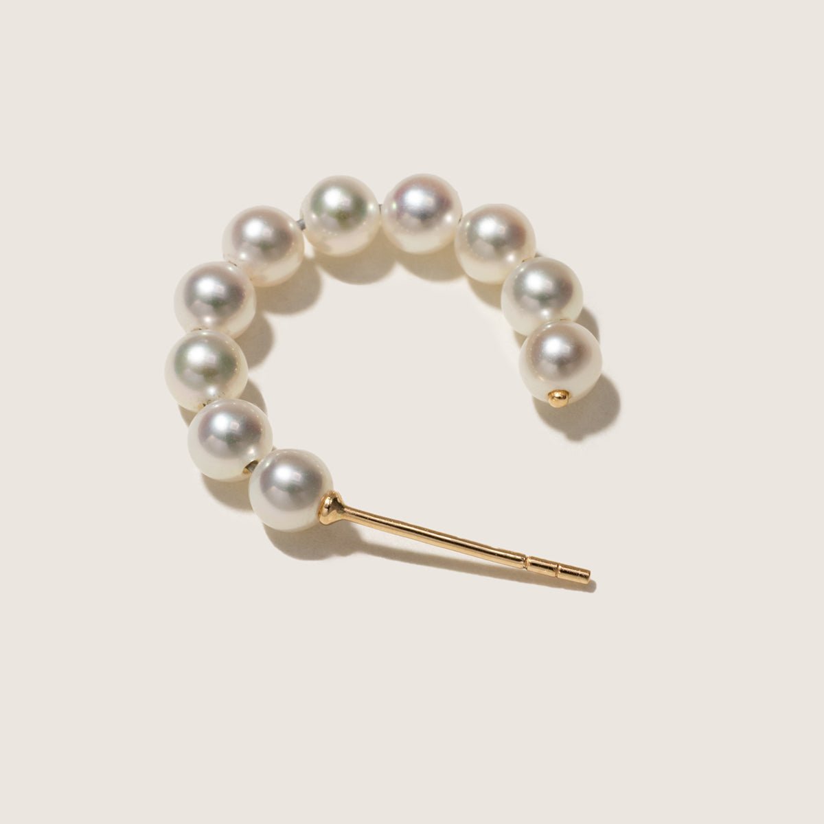 Single gold vermeil freshwater pearl circle earring, top view showing the arc