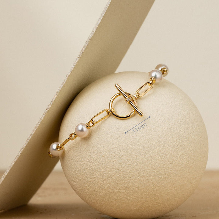 Freshwater pearl gold vermeil toggle bracelet on display sphere showing OT clasp detail with 11mm dimension mark, 925 sterling silver