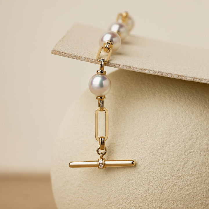 Hanging detail shot of gold vermeil OT toggle bar with lab-grown diamond and paperclip chain links, 925 sterling silver freshwater pearl bracelet
