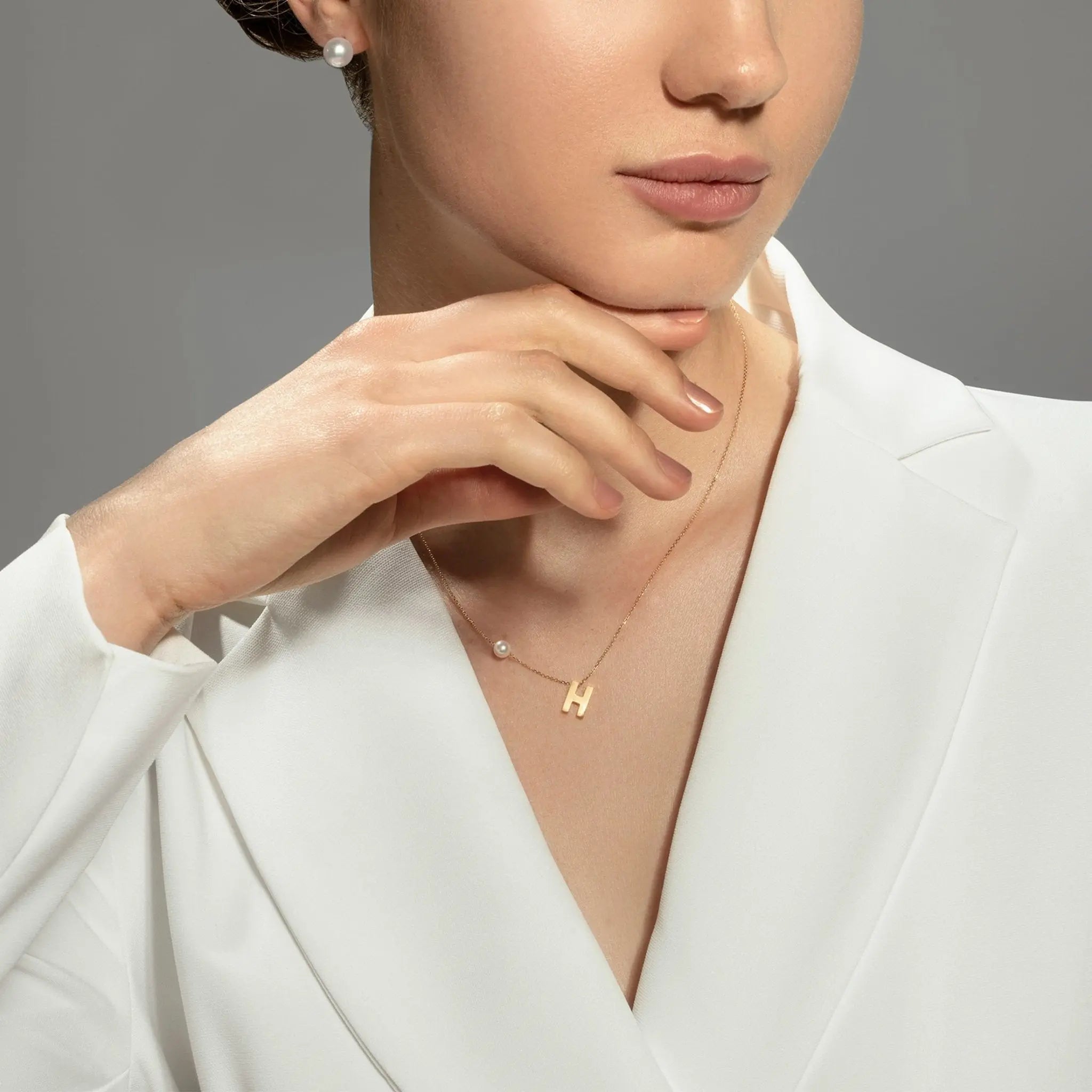 Akoya saltwater pearl 18K gold hanging initials necklace with custom letter charms, elegant jewelry by H Collection.