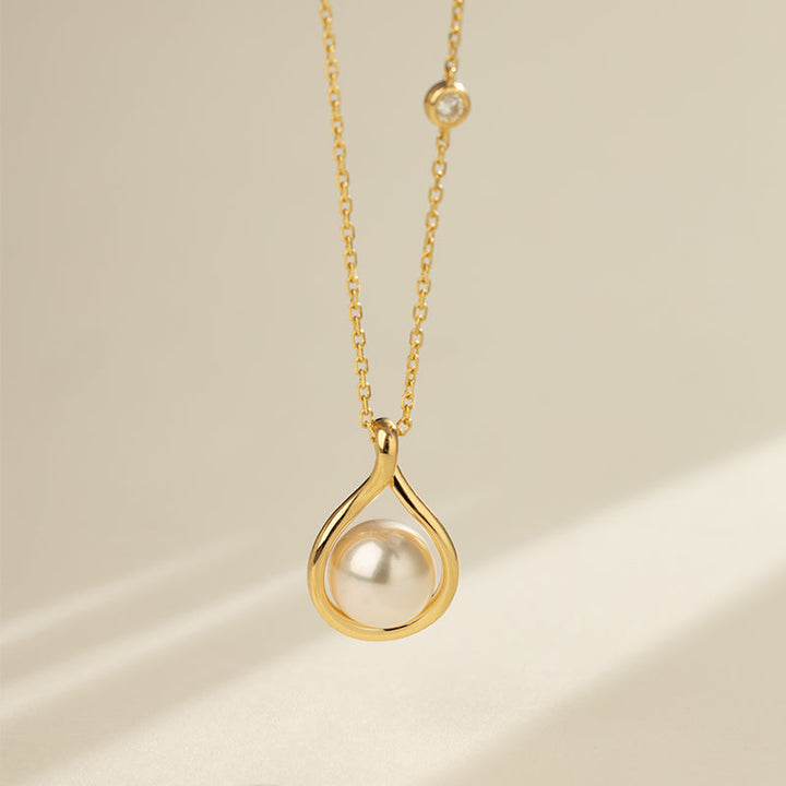 Close-up of AAAAA freshwater pearl set in gold vermeil teardrop pendant on sterling silver chain