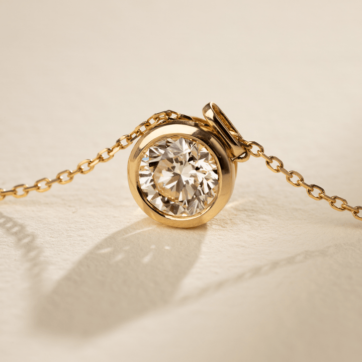 Front view of bezel-set lab-grown diamond gold vermeil pendant, 0.5ct round brilliant