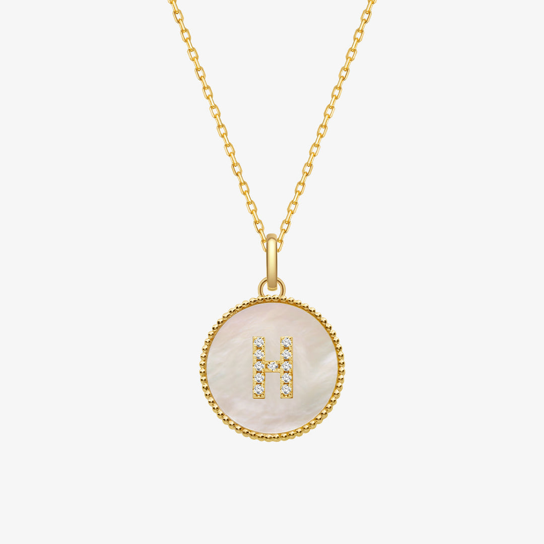 Custom letter mother-of-pearl initial necklace from Lean In Collection featuring a shiny, elegant pendant with a personalized initial.