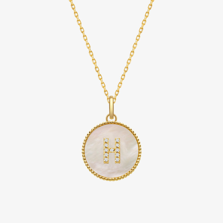 Custom letter mother-of-pearl initial necklace from Lean In Collection featuring a shiny, elegant pendant with a personalized initial.
