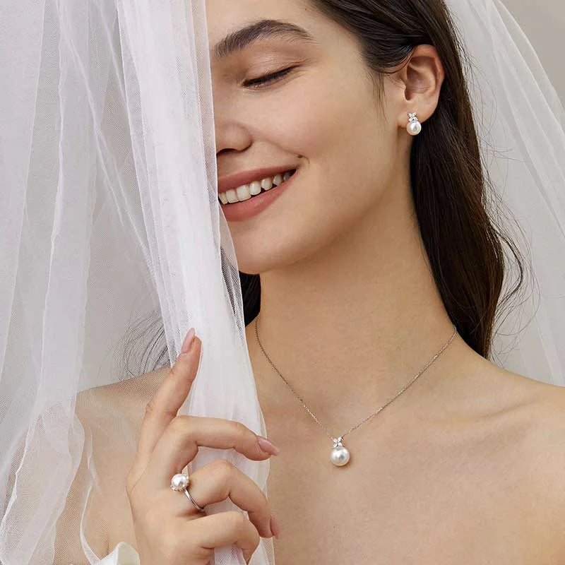 Bride wearing freshwater pearl flower stud earrings