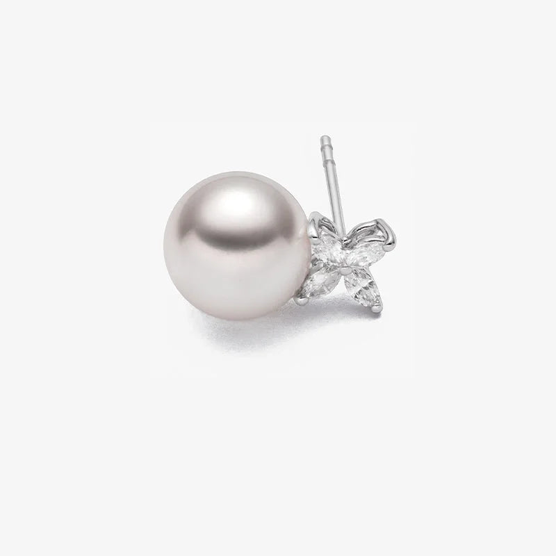 Close-up of a freshwater pearl flower stud earring with marquise lab-grown diamonds