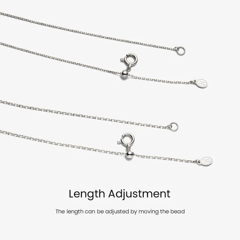 Sterling silver cross chain length adjustment bead and H logo tag detail, adjustable necklace