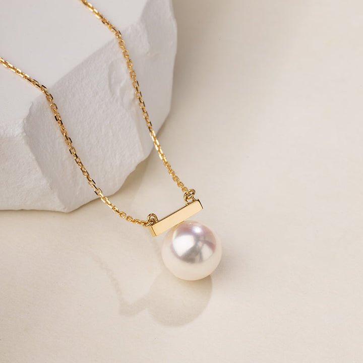 Akoya pearl and 18K gold necklace from Melody Collection featuring a whole rest note pendant on a delicate chain