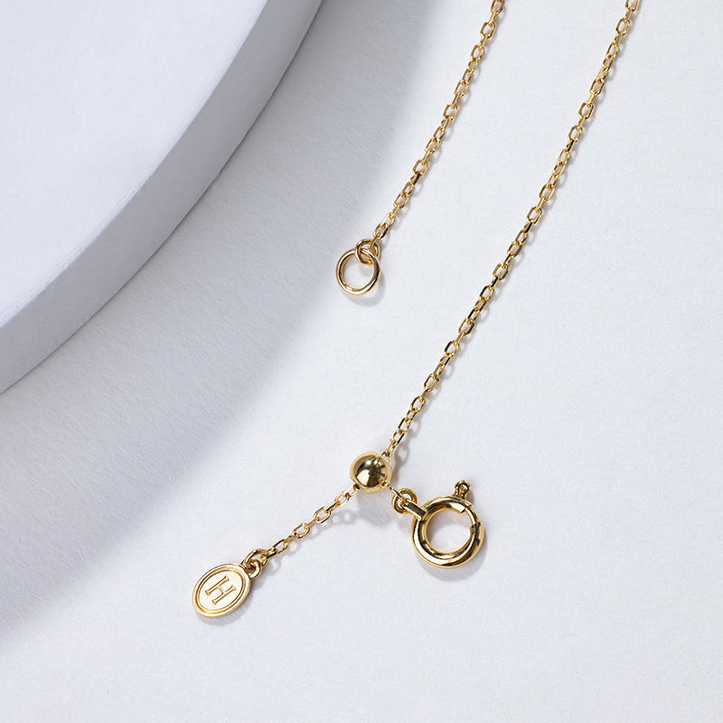 Akoya pearl 18K gold necklace from Melody Collection featuring a whole rest note pendant on a delicate chain.