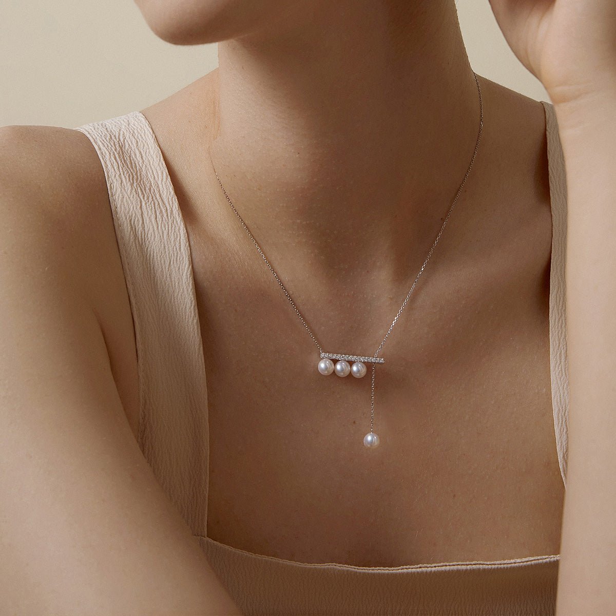 Akoya saltwater pearl 18K white gold necklace with diamond accents from Melody Collection, featuring a balanced beam design.