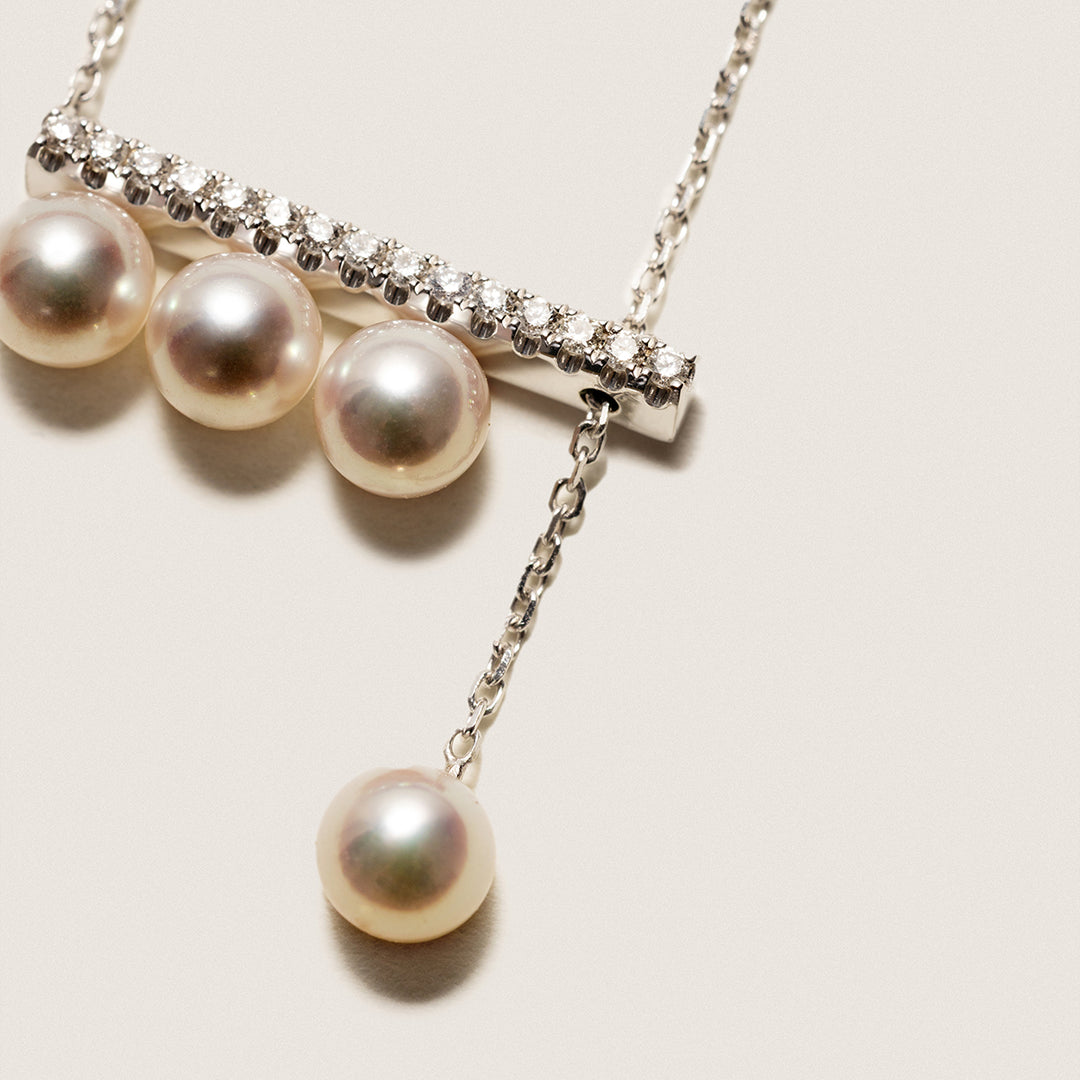 Akoya saltwater pearl necklace with 18K white gold balance beam diamond pendant from Melody Collection