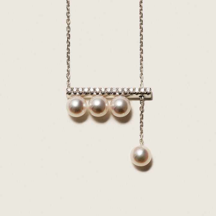Akoya saltwater pearl 18K white gold necklace with diamond accents from Melody Collection, elegant jewelry featuring a balanced beam design.