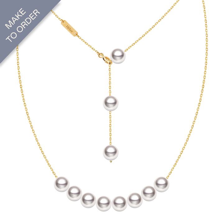 Akoya pearl 18K gold smile necklace from Mermaid's Tear Collection featuring a delicate pearl pendant on a fine gold chain