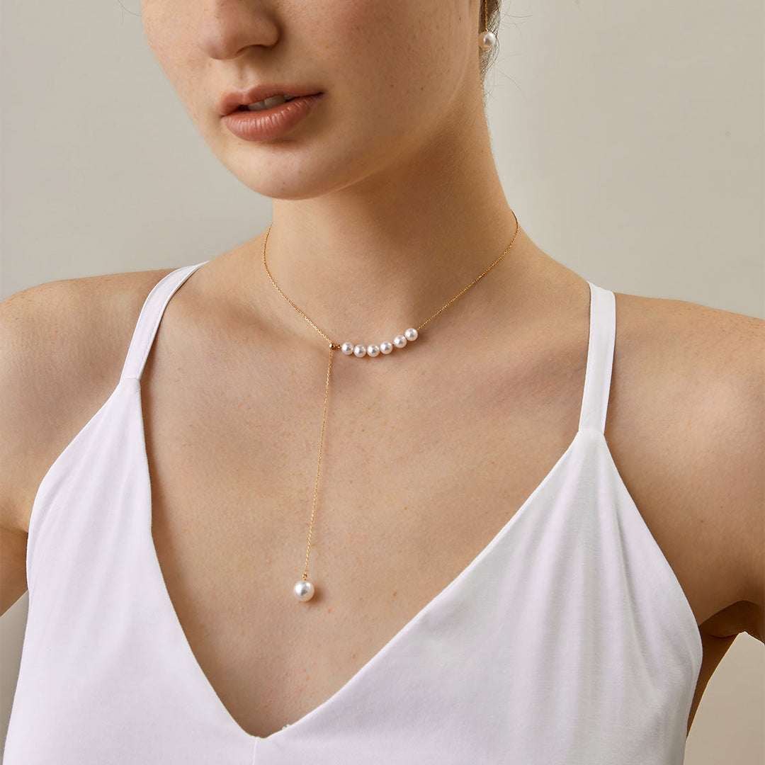 Asymmetrical Akoya pearl 18K gold necklace from Mermaid's Tear Collection with elegant design and lustrous pearls.