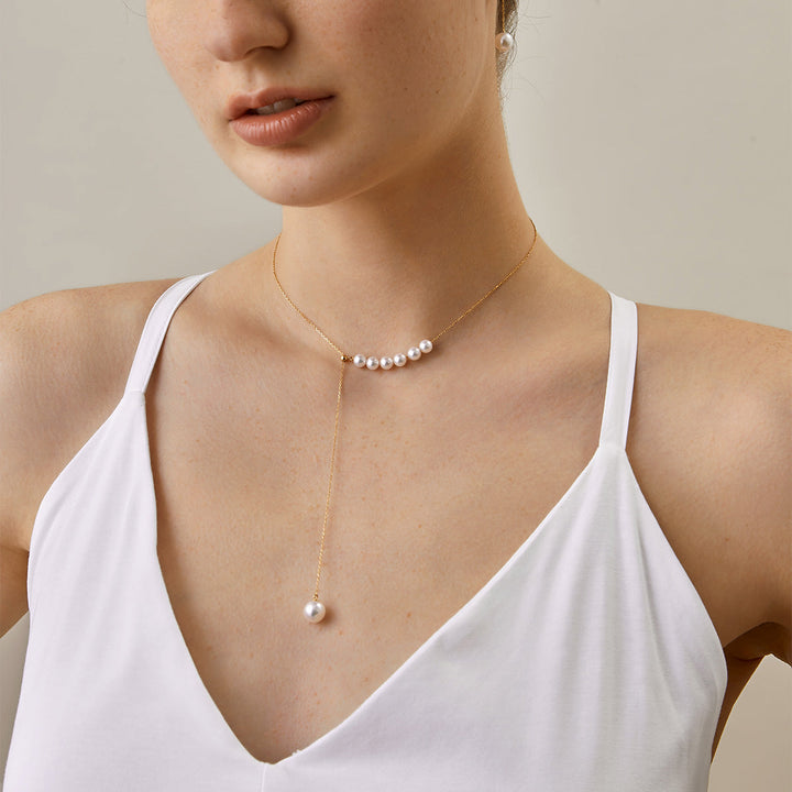 Asymmetrical Akoya pearl 18K gold necklace from Mermaid's Tear Collection with elegant design and lustrous pearls.