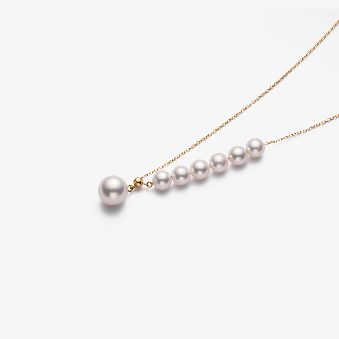 Asymmetrical Akoya pearl necklace with 18K gold chain from Mermaid's Tear Collection, featuring a lustrous pearl design.
