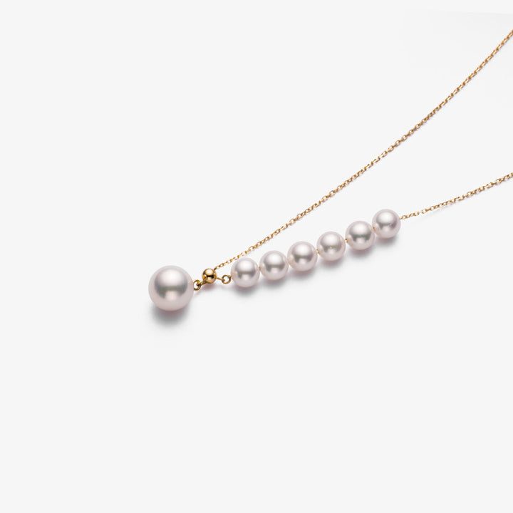 Asymmetrical Akoya pearl necklace with 18K gold chain from Mermaid's Tear Collection, featuring a lustrous pearl design.